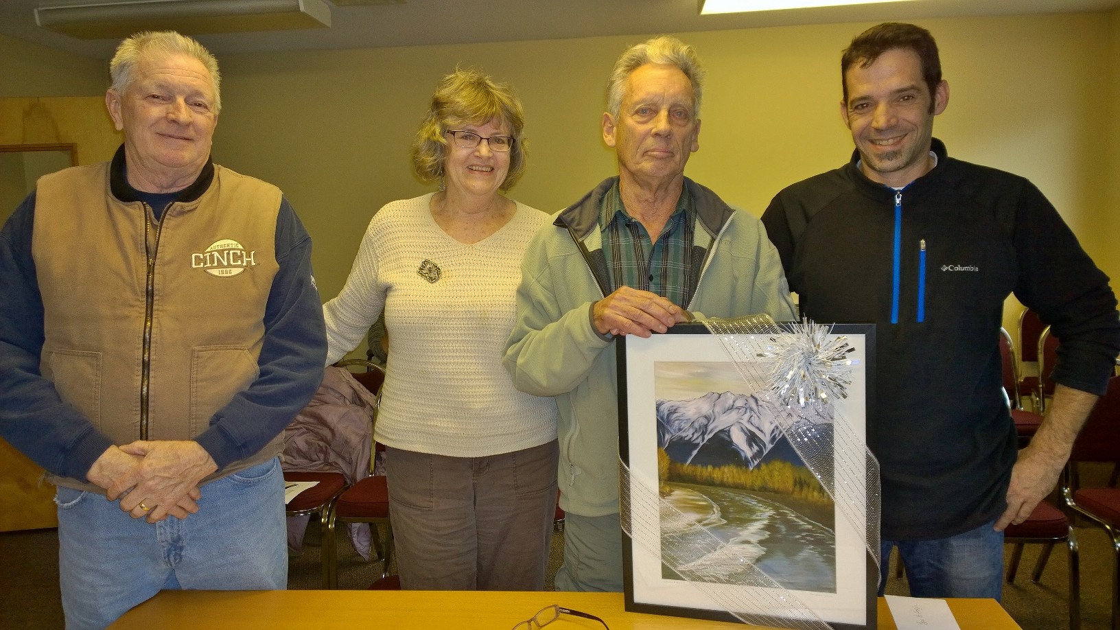 Area C Director Russell Mack (far left) and Village of Pemberton Mayor Mike Richman (far right) present Jan and Hugh Naylor with a Karen Love painting at the November 23 signing ceremony of a Right of Way over their property, securing access to trails and the river for generations of future users