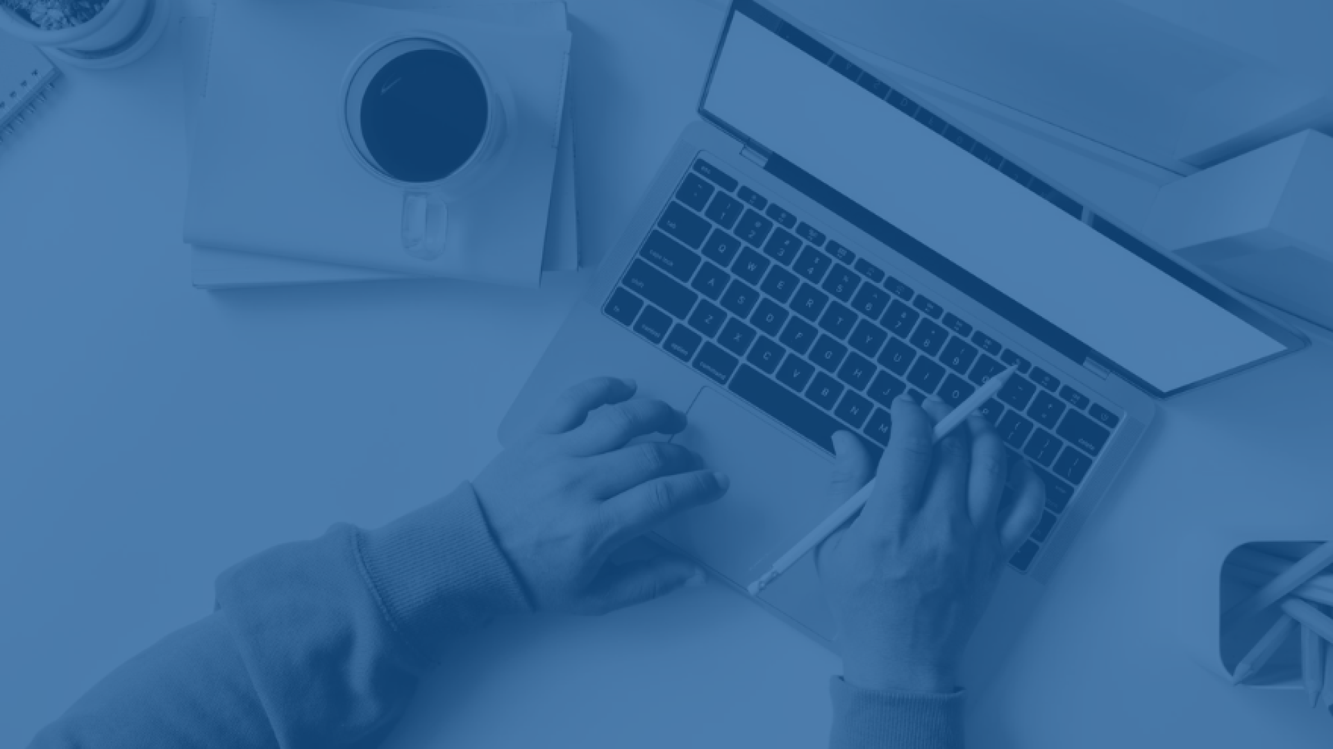 hands over a laptop keyboard